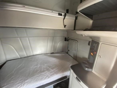 Peterbilt 579 sleeper cab interior showing bunk area and control panel