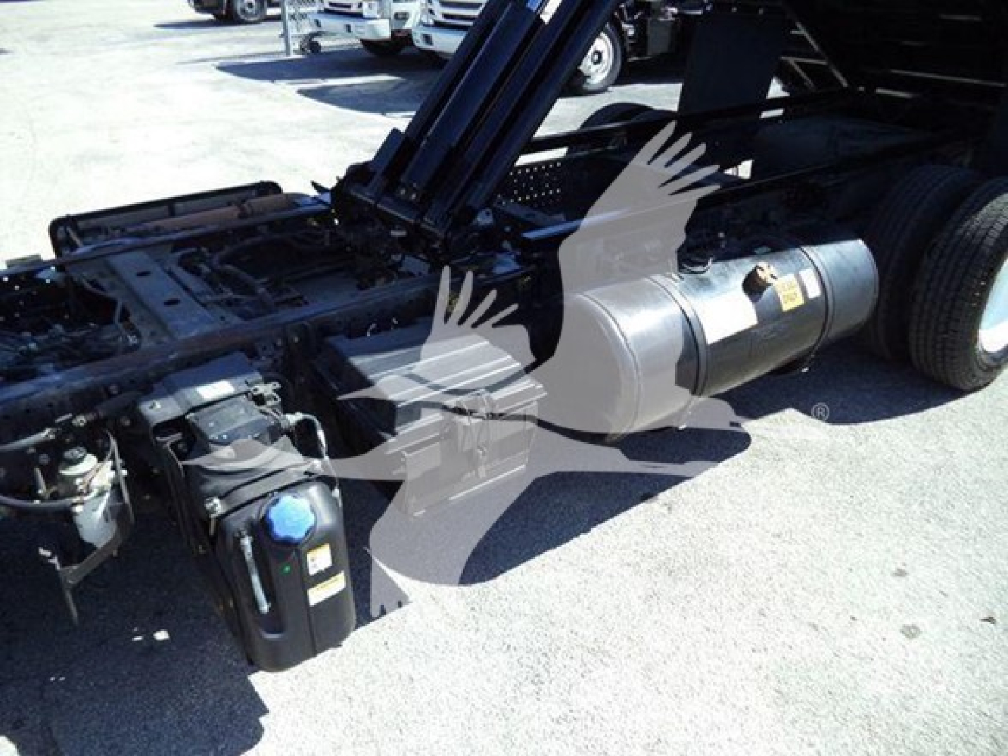 Isuzu NPR truck chassis showing fuel tank and hydraulic components