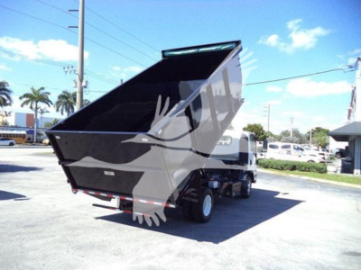 Isuzu NPR dump truck with raised dump bed viewed from rear-right side showing cargo bed and chassis.