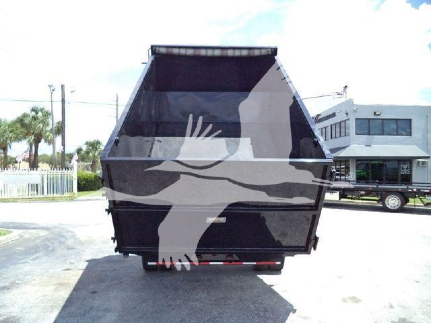 Ford F-550 dump truck bed viewed from rear, open-top dump body with hydraulic elements not visible.