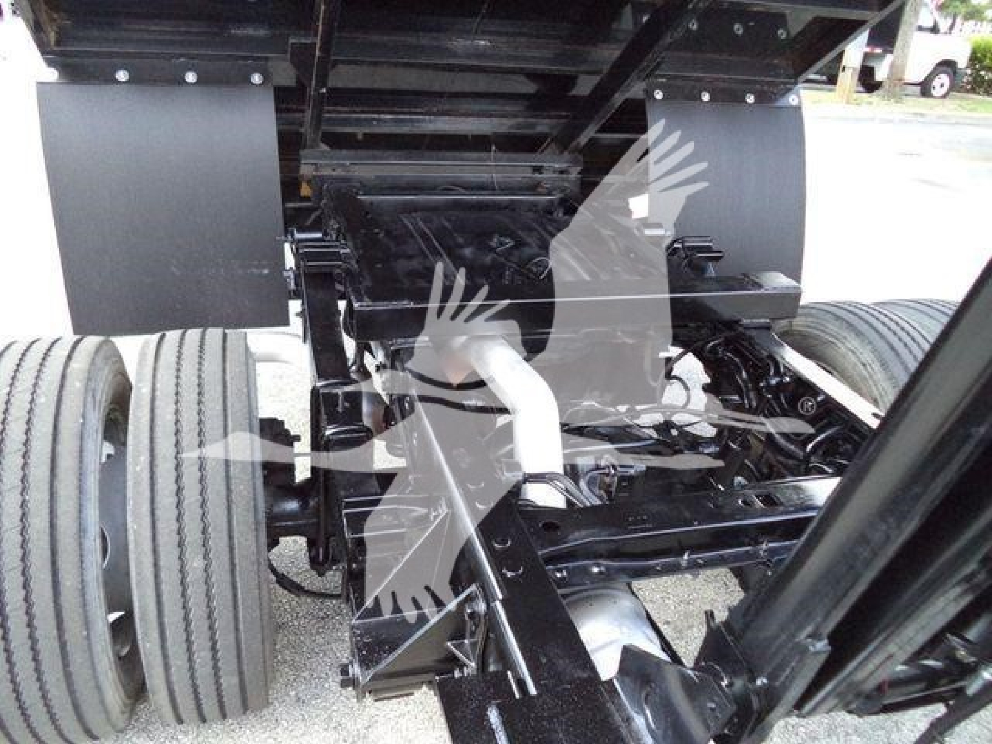 Ford F-550 undercarriage showing drivetrain components and rear axle assembly.