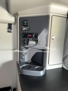 Peterbilt 579 cab interior panel showing controls and cup holder area.