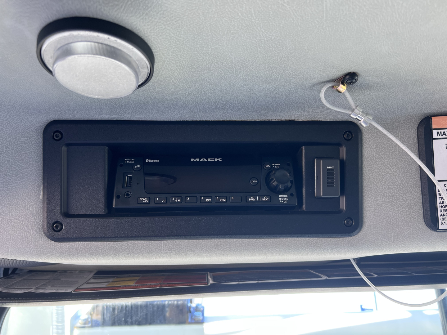 Mack TE64 cab interior showing in-dash stereo head unit and controls.