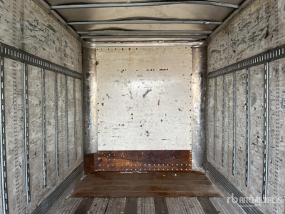 Trailer interior showing empty cargo area with metal side rails and wooden floor in a 2004 Wabash DVDBHPC trailer.
