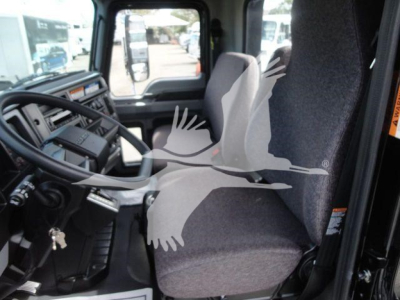  cab interior of a Mack MD6 truck showing steering wheel, dashboard, and driver seat with imprint watermark across image