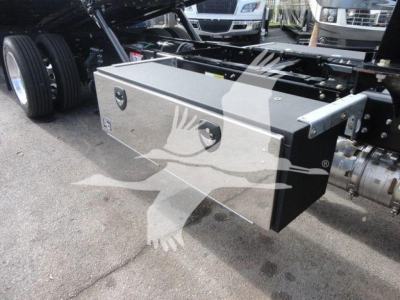 MD6 truck chassis showing a metallic toolbox mounted on the side with a badge and locking handles.