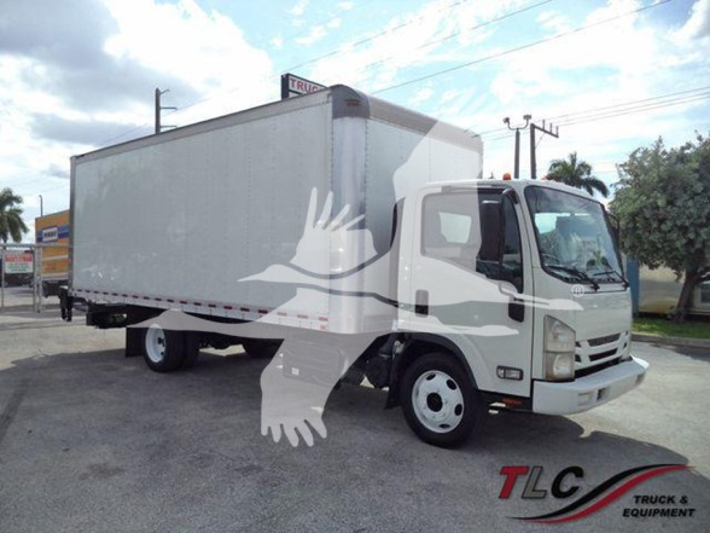 Isuzu NRR box truck in-service with a large white cargo box and cab, front three-quarter view.
