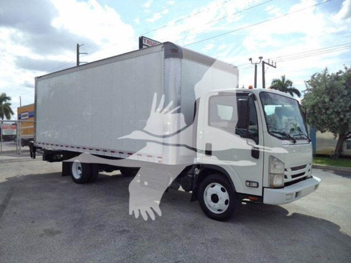 Isuzu NRR box truck side view showing cargo box and cab with front grille