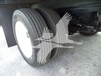 Isuzu box truck rear dual wheels showing tires and undercarriage with a watermark overlay.