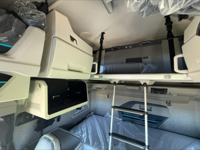 Volvo VNL64T860 sleeper cab interior with upper bunk and storage compartments visible