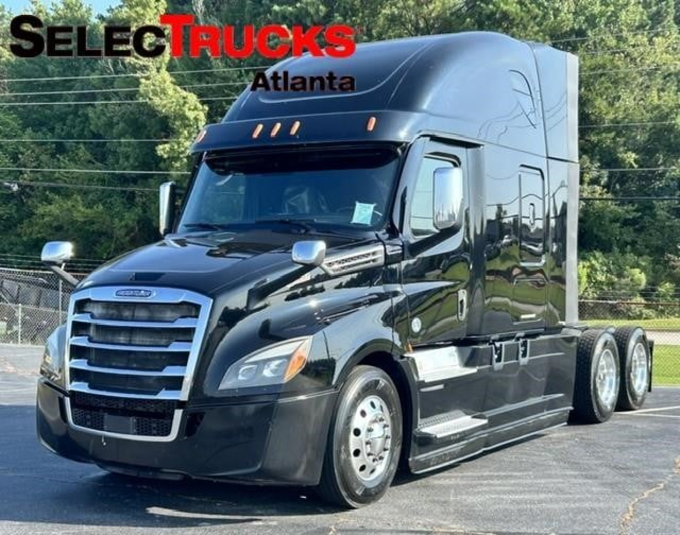 Truck cab showing 2022 Freightliner Cascadia 126 with SelectTrucks Atlanta branding in front.