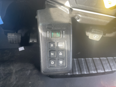 Mack MD7 cab interior showing Allison automatic transmission gear selector with R N D and mode buttons.