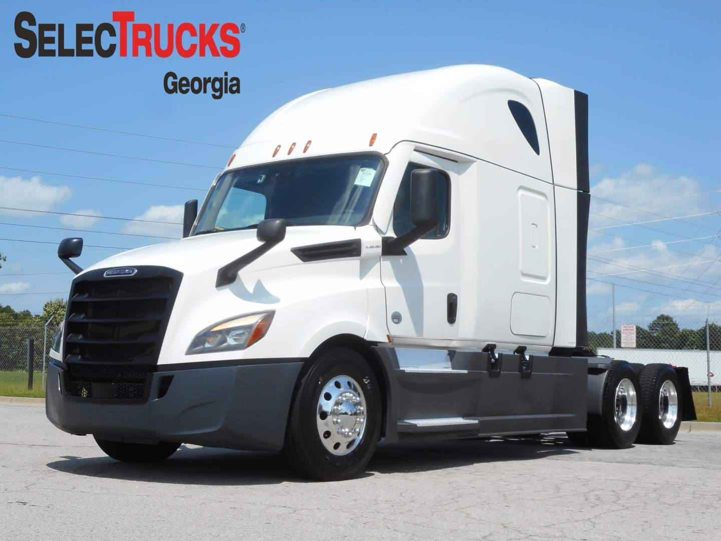 Truck cab showing Freightliner Cascadia 126 exterior with sleeper bay and front grille, SelectTrucks Georgia logo in corner.