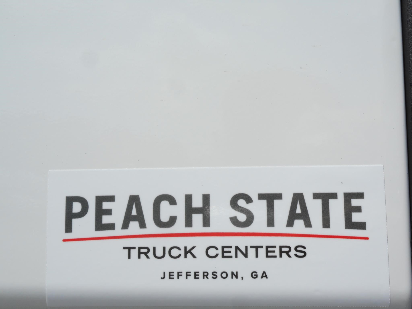 Vehicle label showing Peach State Truck Centers logo with Jefferson, GA location.