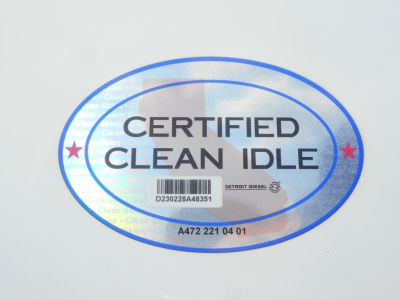 Sticker reading CERTIFIED CLEAN IDLE with barcode and Detroit Diesel branding on a white surface.