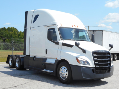 Freightliner Cascadia 126 semi-truck cab front-left view with white exterior and black grille; no visible labels or text readable on body.