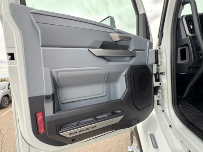 Mack AN64T truck door interior view showing panel with storage pocket and speaker grille.