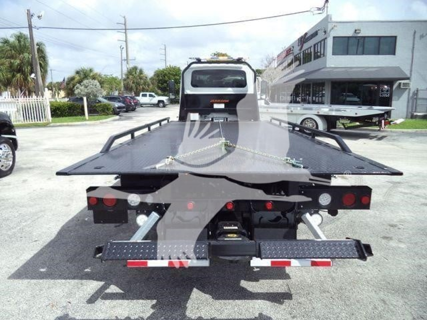 Truck bed and rear of 2027 International MV rollback truck showing flatbed and rear lights