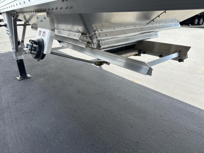 Trailer hitch area of a new Timpte hopper trailer showing undercarriage and support structure.