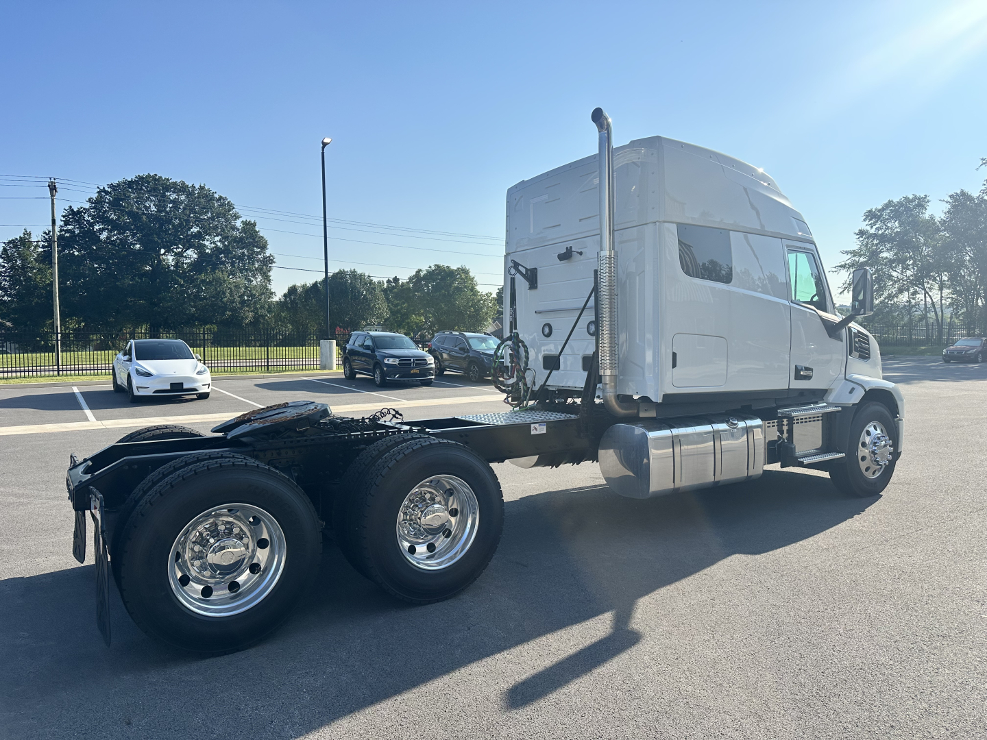 Mack PR64T76M conventional sleeper truck side view showing chassis and wheels.