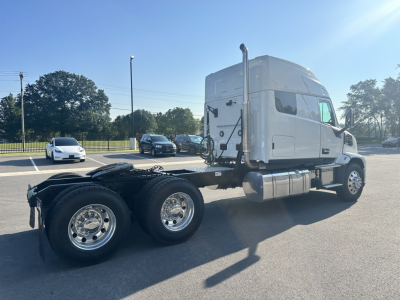 Mack PR64T76M conventional sleeper truck side view showing chassis and wheels.