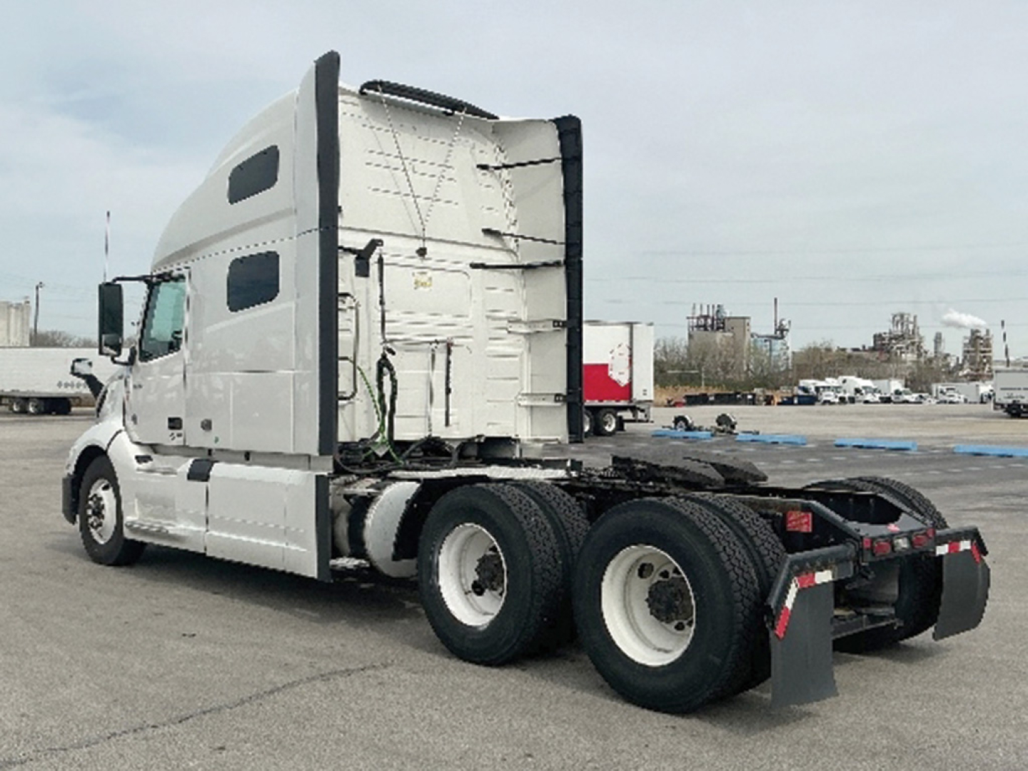 Volvo VNL 760 sleeper cab tractor showing side profile and rear chassis with dual rear axles.