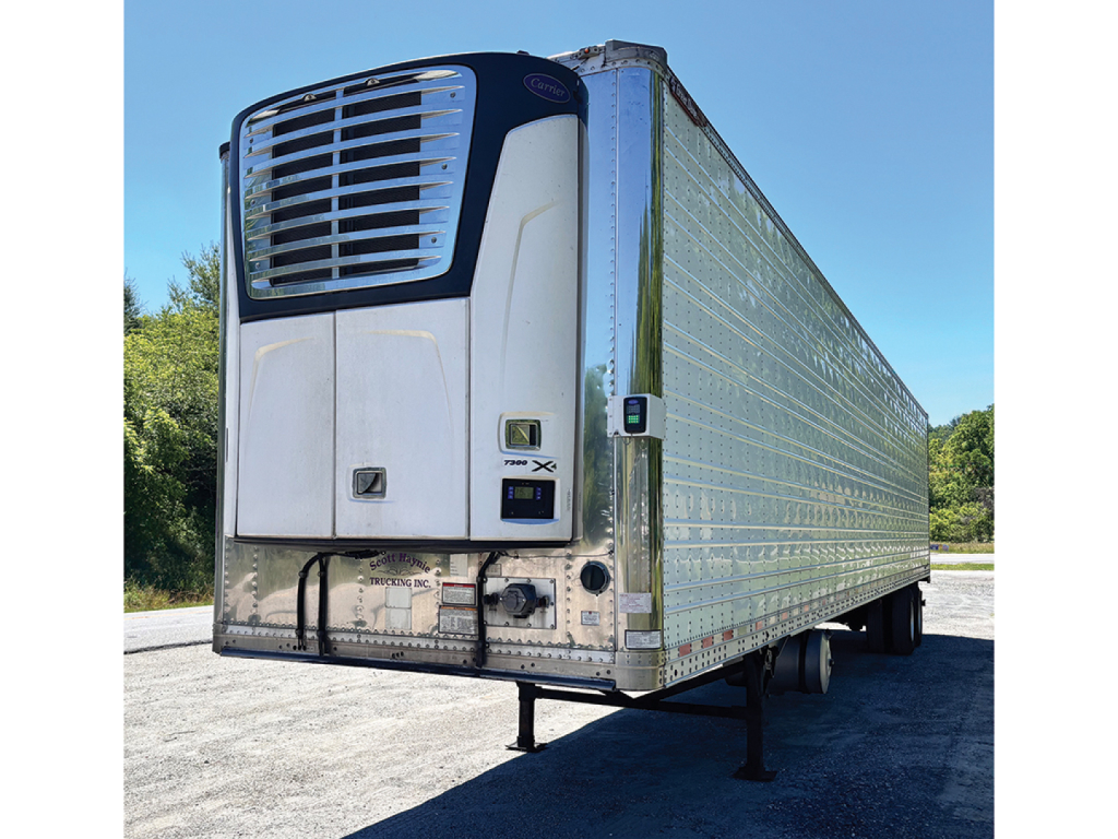Great Dane Everest SS trailer with ice-cooled reefer unit, front grate, silver reflective panels, and wheel assembly visible under trailer.