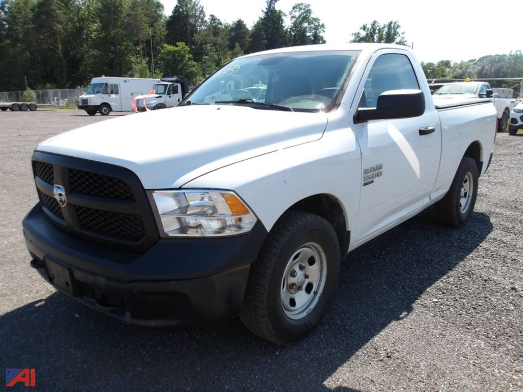 Ram 1500 pickup truck in white, front-left view, 2020 model year, basic steel wheels, black front bumper, single cab with extended bed.