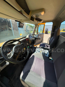 Interior view of a 2012 International DuraStar cab showing steering wheel, dashboard, and driver seat with text and controls visible.