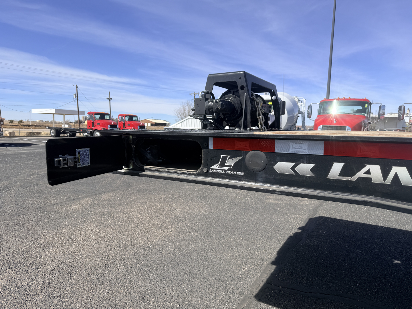 Landoll trailer frame with 40 ton traveling axle, front section showing I-beam channel and hitch area, 'LANDOLL' branding along side.