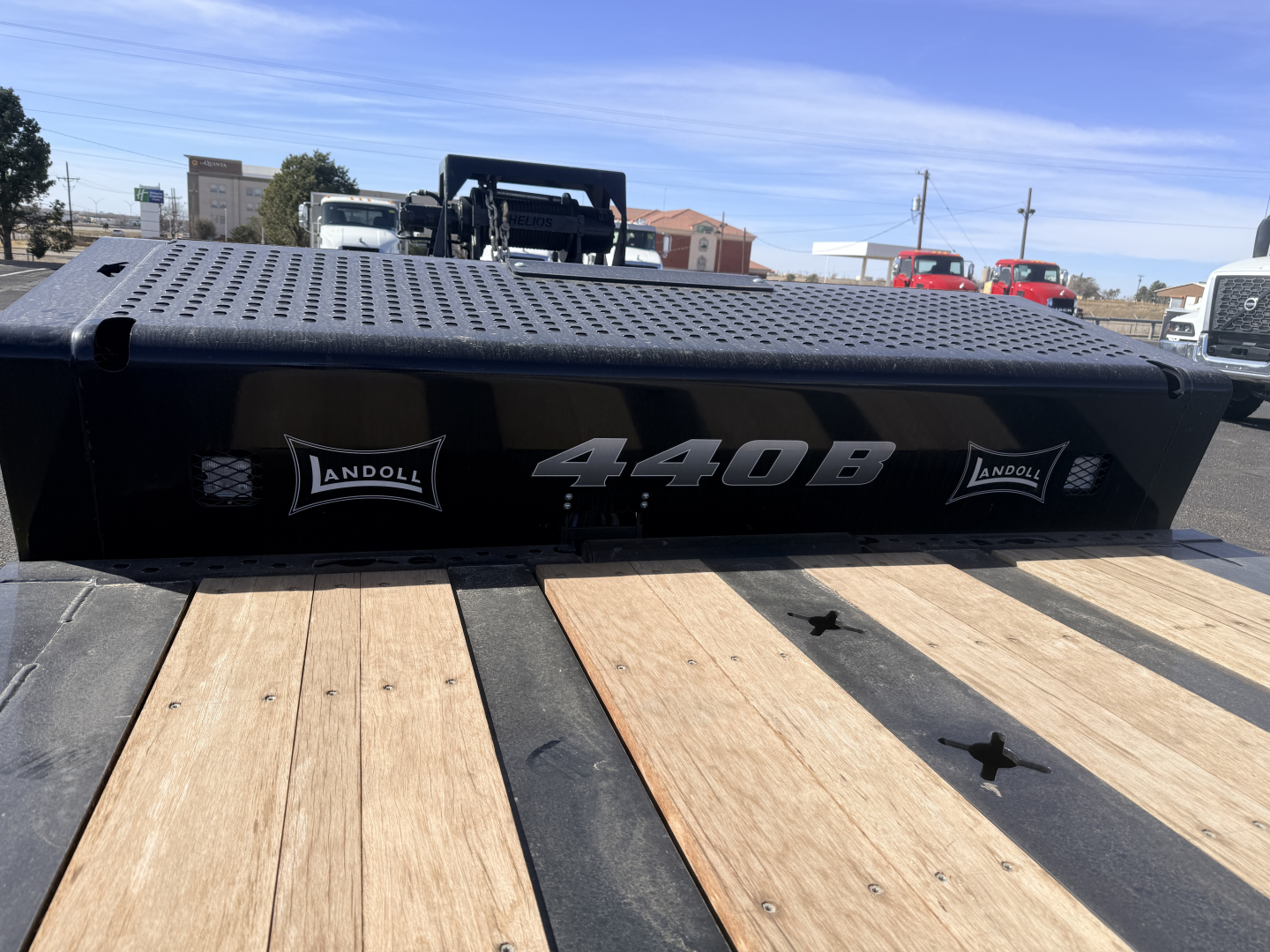 Landoll 440B-53 40 Ton traveling axle lowboy trailer deck plate with 440B logo and Landoll decals.