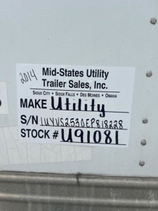 Label on trailer showing make utility, S/N 1UYVS2530EP818228, stock U91081.