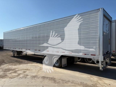 Vanguard R8000B trailer in reefer category showing long aluminum panel body with white bird graphic on side and tandem axle wheels.