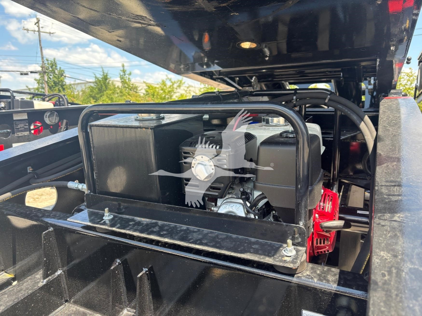 Fontaine Renegade N12 trailer engine bay shows fuel tank and hydraulic components with black metal frame, label areas, and wiring visible.