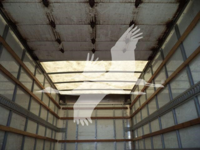 Isuzu NPR HD truck cab interior cargo area with empty box truck bay