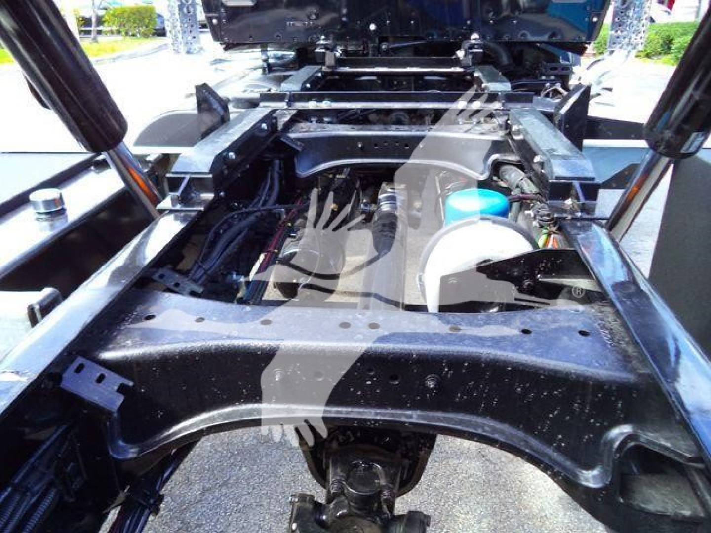 Kenworth T880 chassis frame and engine bay area showing front suspension crossmember and hydraulic lines