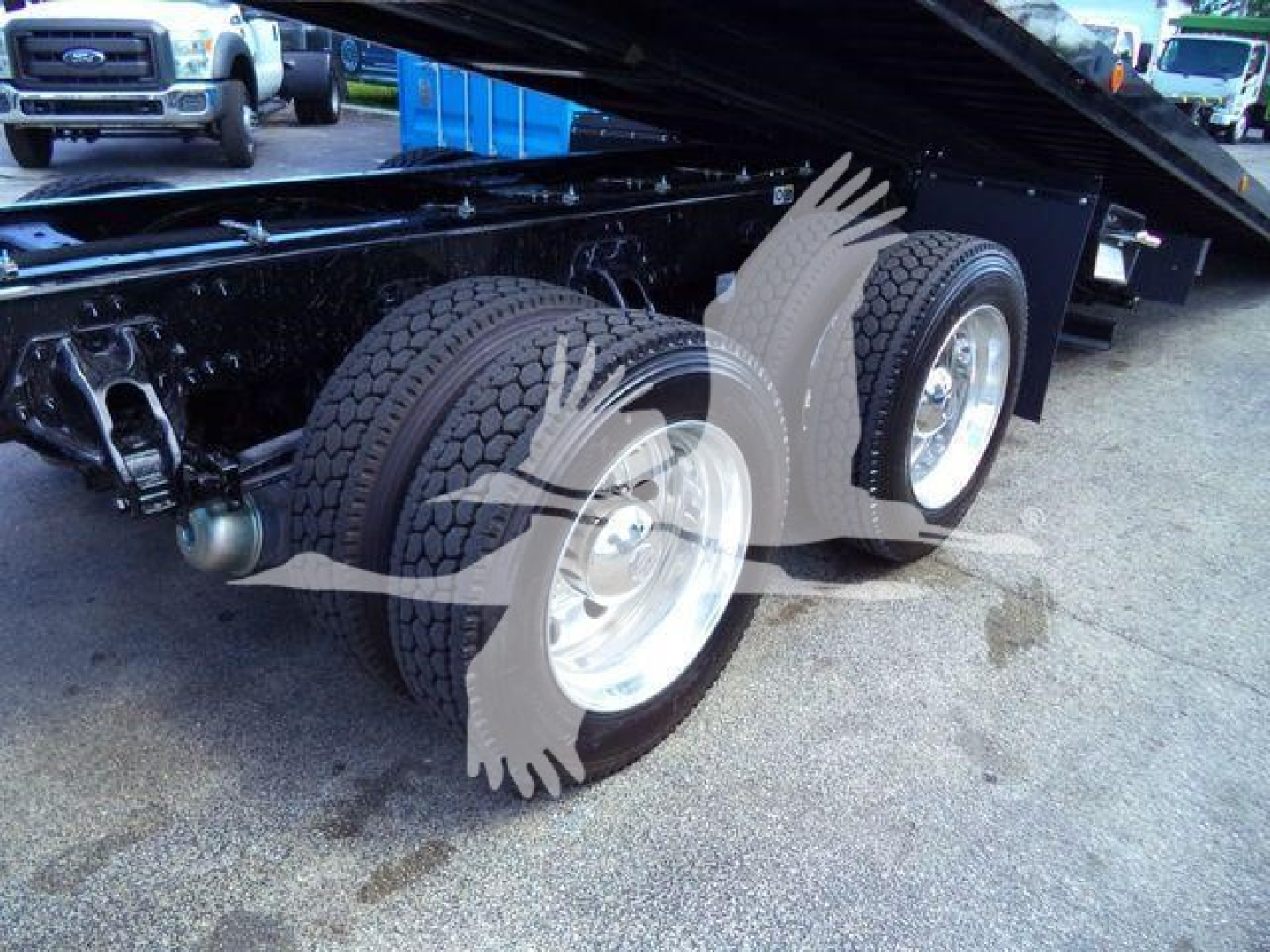Kenworth T880 rollback truck dual rear wheels and chassis undercarriage showing dual tires and lift mechanism.