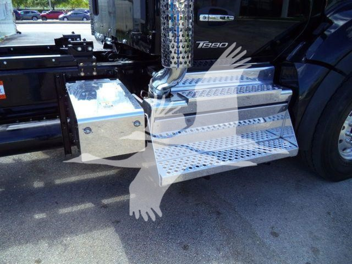 Kenworth T880 side view showing polished aluminum work steps and fuel/air intake platform with perforated steps and chrome exhaust stack.
