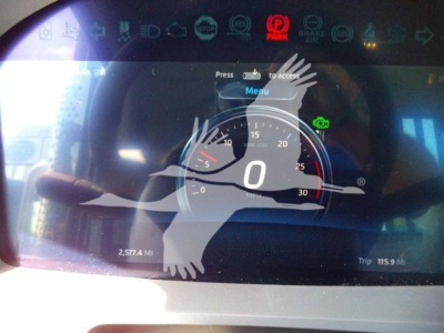 Dashboard display of a 2026 Kenworth T880 showing speedometer with 0 mph, trip metrics, and digital icons. Stock number J68211 context via overlay. 