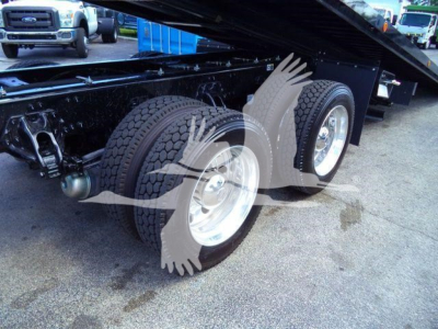 Kenworth T880 rollback truck dual rear wheels and chassis undercarriage showing dual tires and lift mechanism.