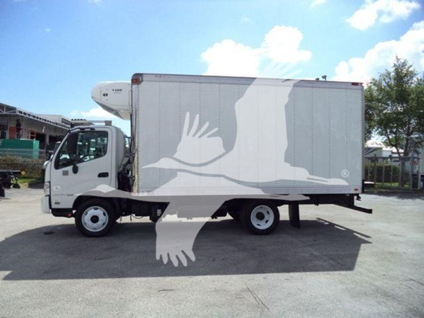 Hino 195 refrigerated truck side view showing box body and cab with refrigeration unit
