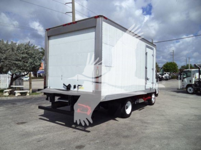 Rear-right side of a white 2019 Hino 195 refrigerated box truck. Visible features: box body, rear bumper with taillight, undercarriage, white wheels. No legible labels or text visible on the vehicle.