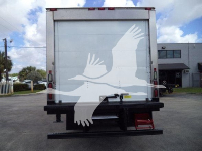Rear view of a 2019 Hino 195 refrigerated truck showing closed cargo area and rear bumper with small red step.