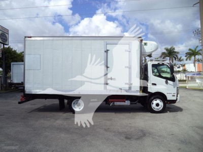 Hino 195 refrigerated truck side view showing cargo box and cab with white exterior.