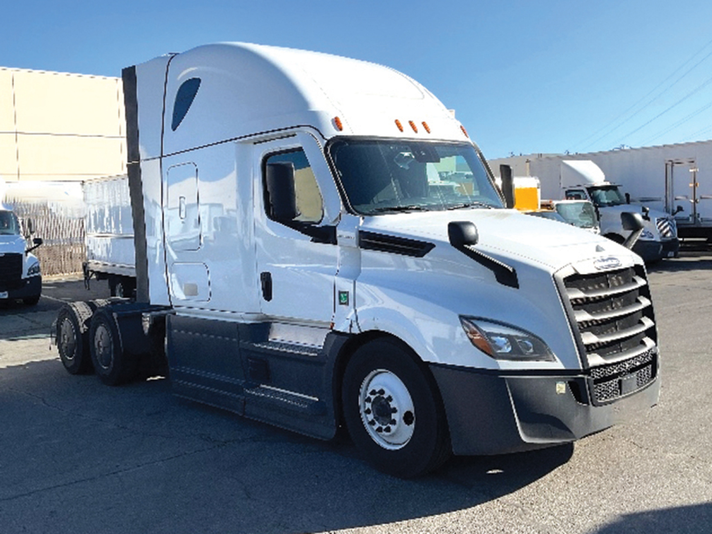 Truck cab side view with sleeper, front grille, and wheels. No legible small text visible on components in this image.