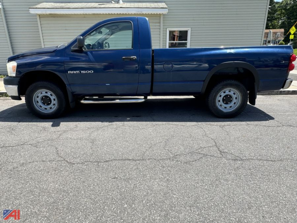 Blue 2007 Dodge Ram 1500 pickup truck side profile showing extended cab, two-tone blue paint, single cab, long bed, steel wheels, running boards, and RAM 1500 badge on front door.