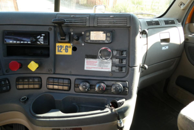 Truck dashboard of a 2017 Freightliner Cascadia 125 daycab showing instrument cluster, control switches, and gauges.