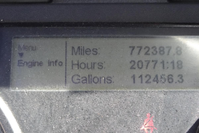 Dashboard display showing miles 772387.6, hours 20771:18, gallons 112456.3 on Freightliner Cascadia 125 truck