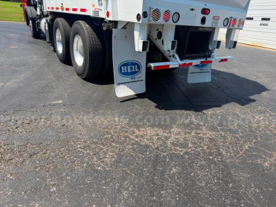 Rear view of 2019 Crane Carrier ASL garbage truck showing HELI mud flaps and dual rear tires.