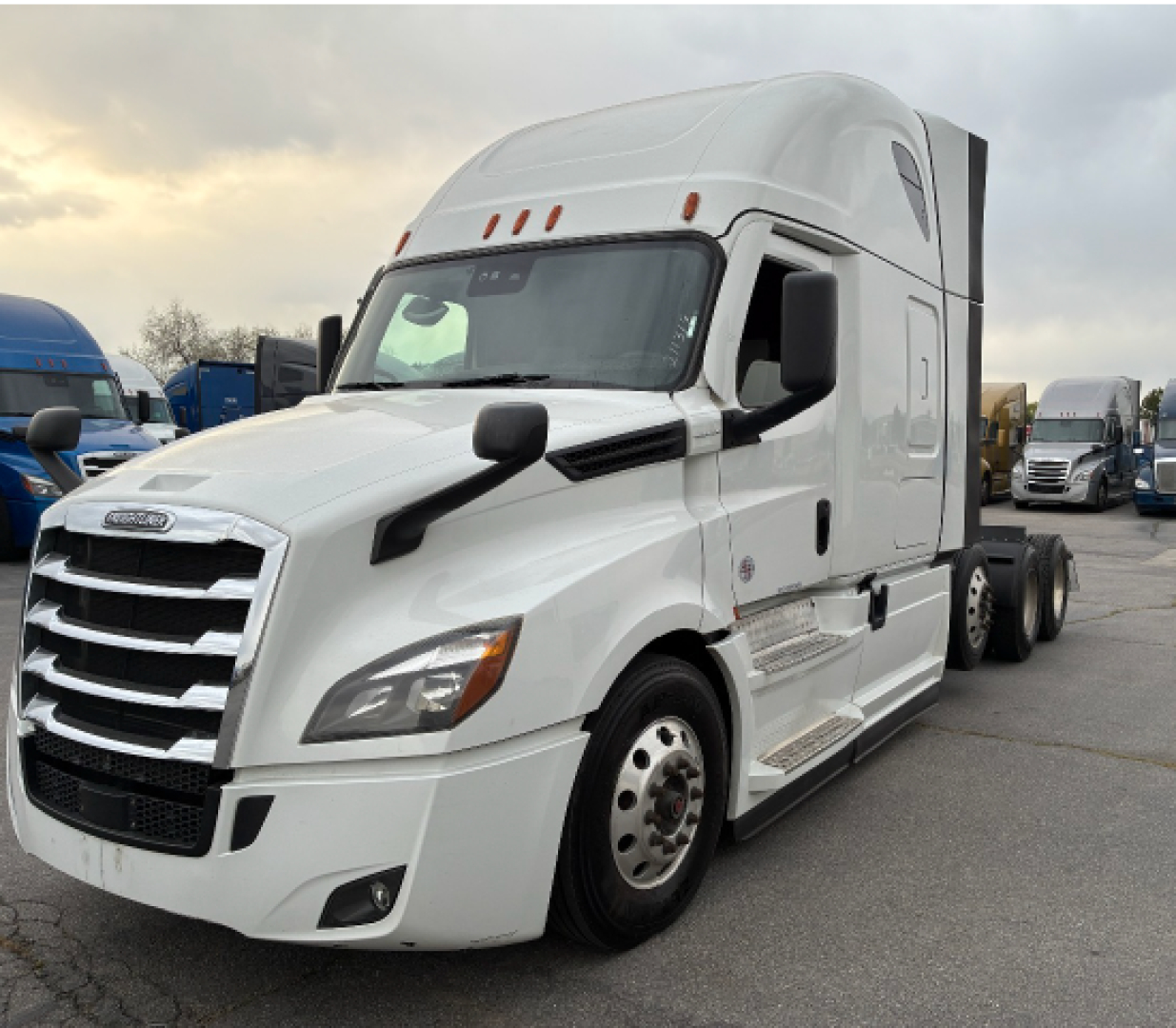 Freightliner CA-126 tractor in white, side view showing sleeper cab with large grille, dual fuel tanks, and badge around front fender.